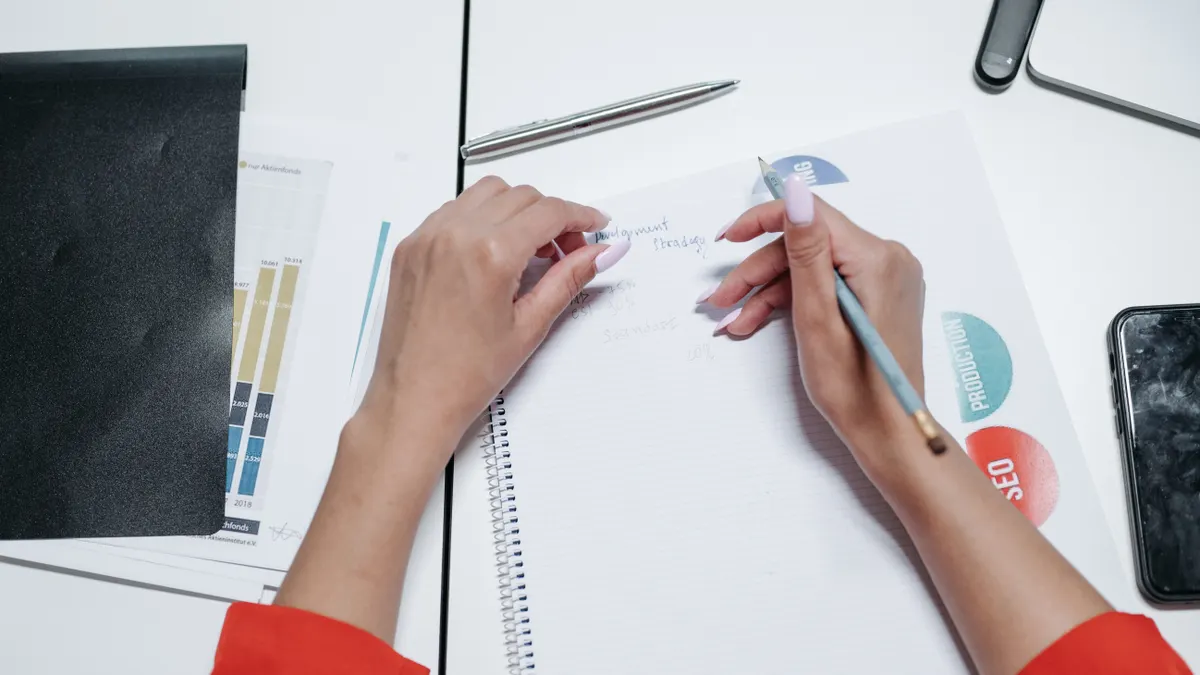 Best tools for writing SEO content — Person Writing on White Paper