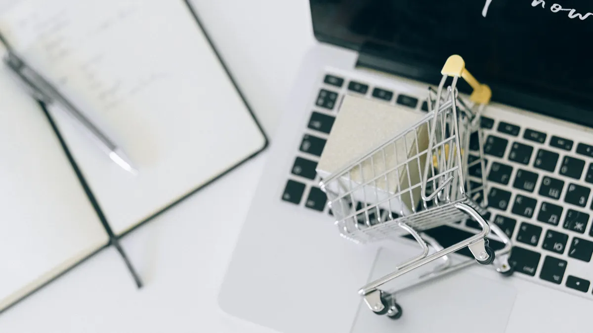 shopping cart on laptop keyboard