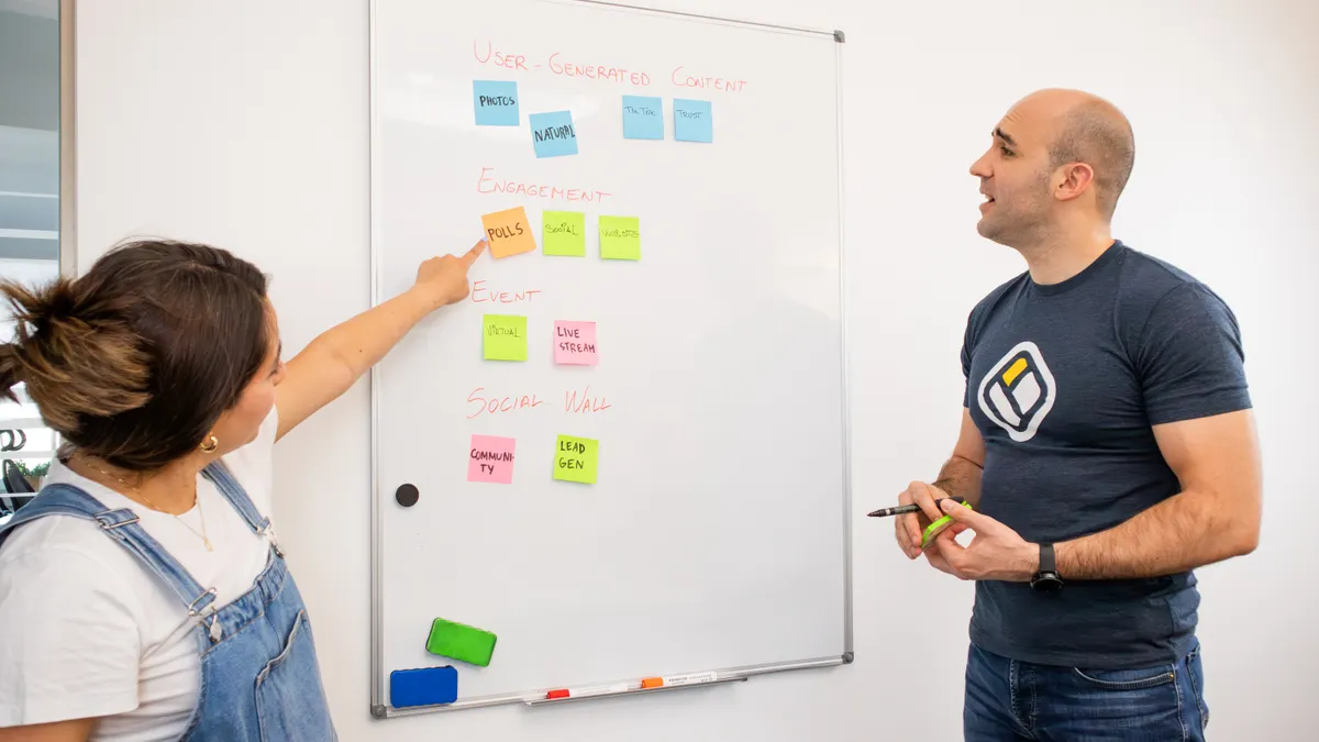 Team planning content with sticky notes on a whiteboard